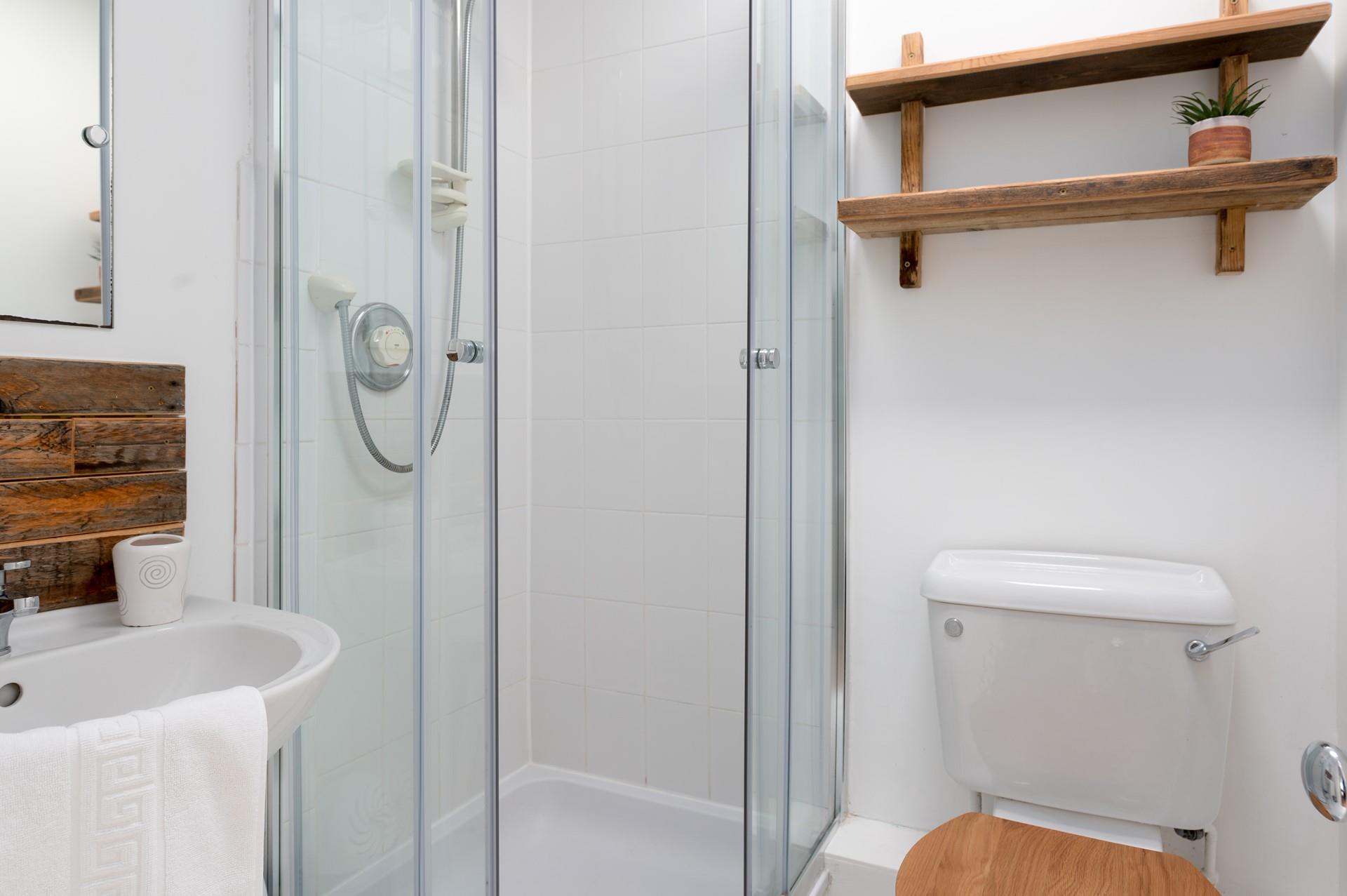 The annexe is complete with its own bathroom, perfect for rinsing off the sand after a day sunbathing on the beach.