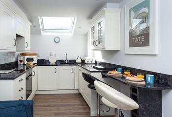 The kitchen is fabulously well-equipped whilst the skylight window lets the summer light shine down on you as you cook.