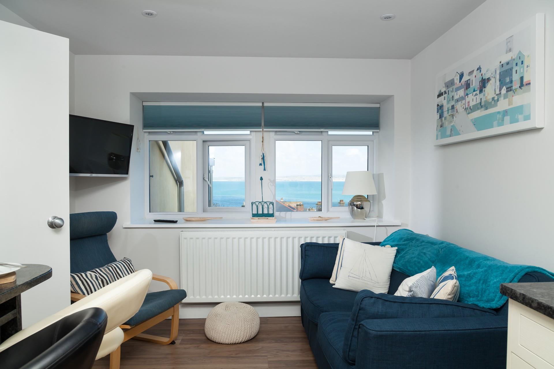 Decorated in dreamy cream and pastel shades, this is the perfect seaside retreat for couples or solo travellers.