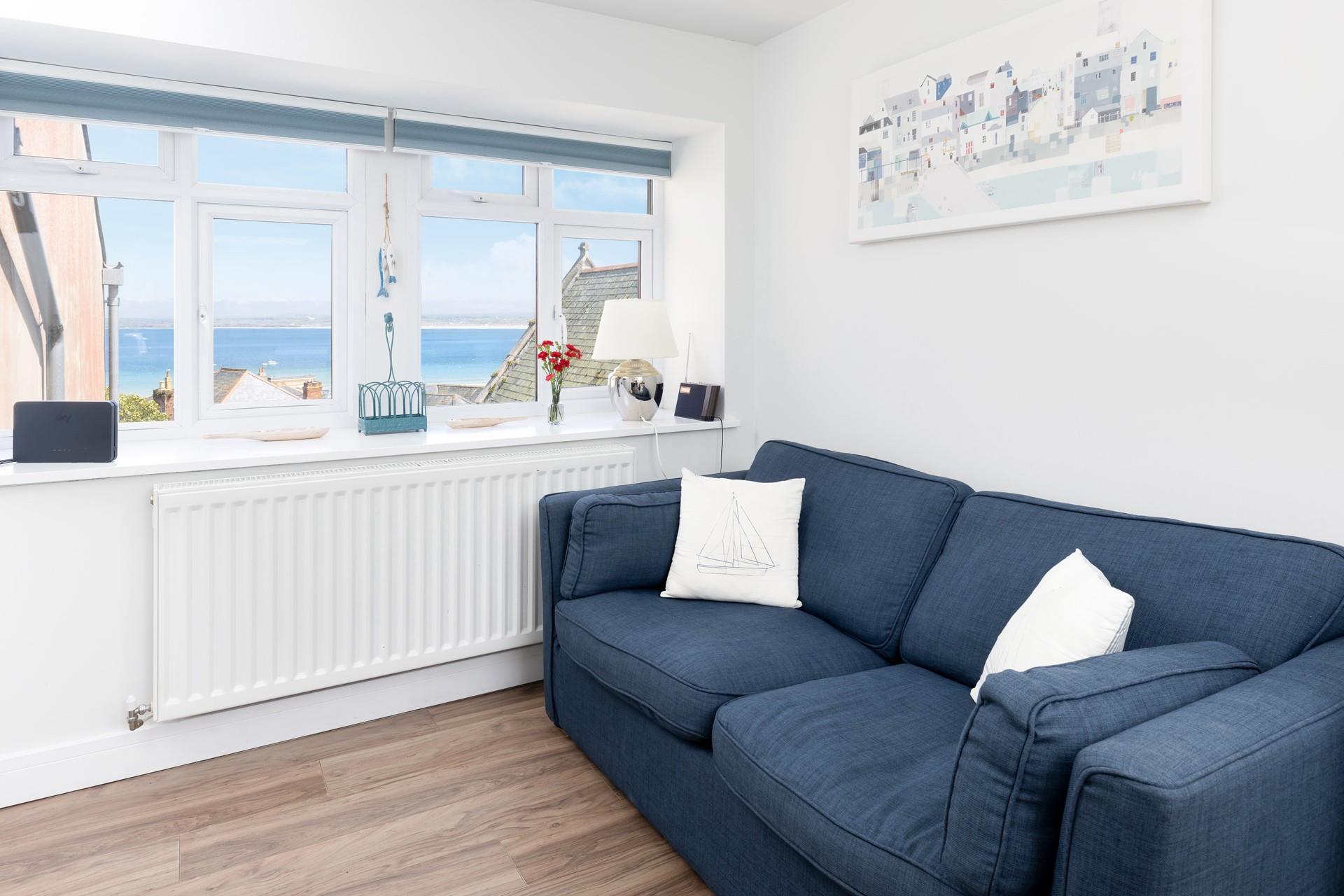 The sofa offers a glorious spot to indulge in your first coffee of the day whilst watching the sunrise over St Ives.