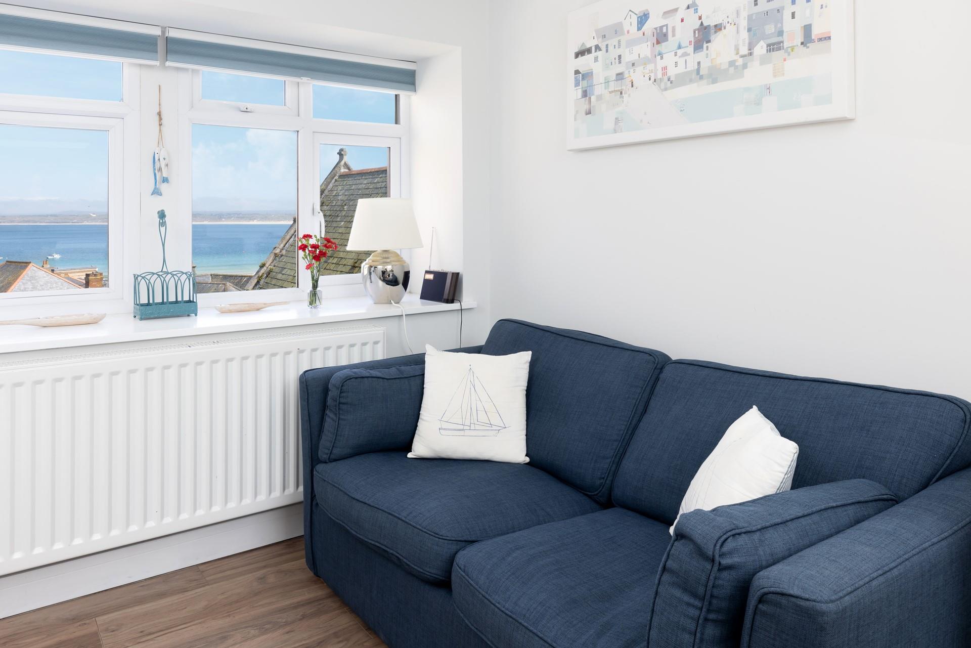 Gaze out at the sea views with a glass of your favourite wine and snuggle up for the evening. 