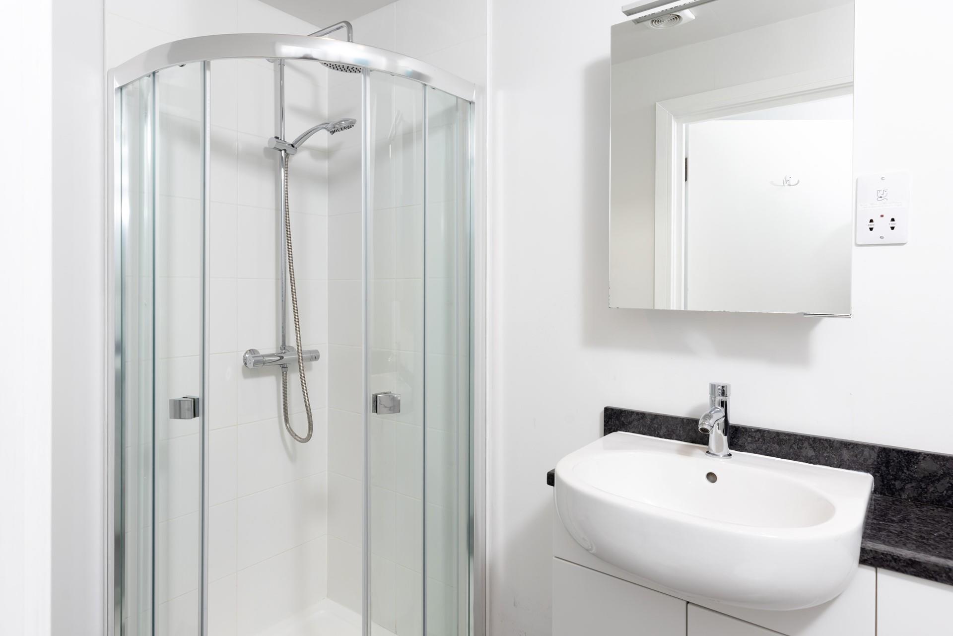 Start your day with a refreshing shower in the bright bathroom. 