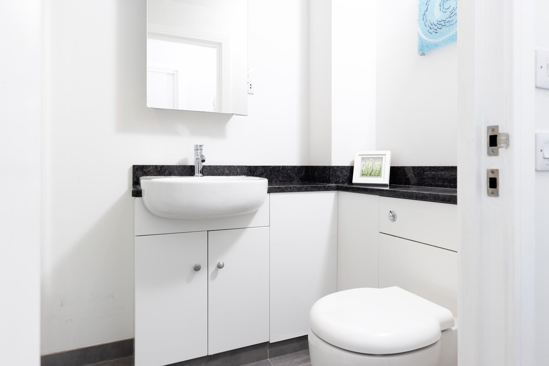 The bathroom provides the perfect space to get ready for an evening in the town. 