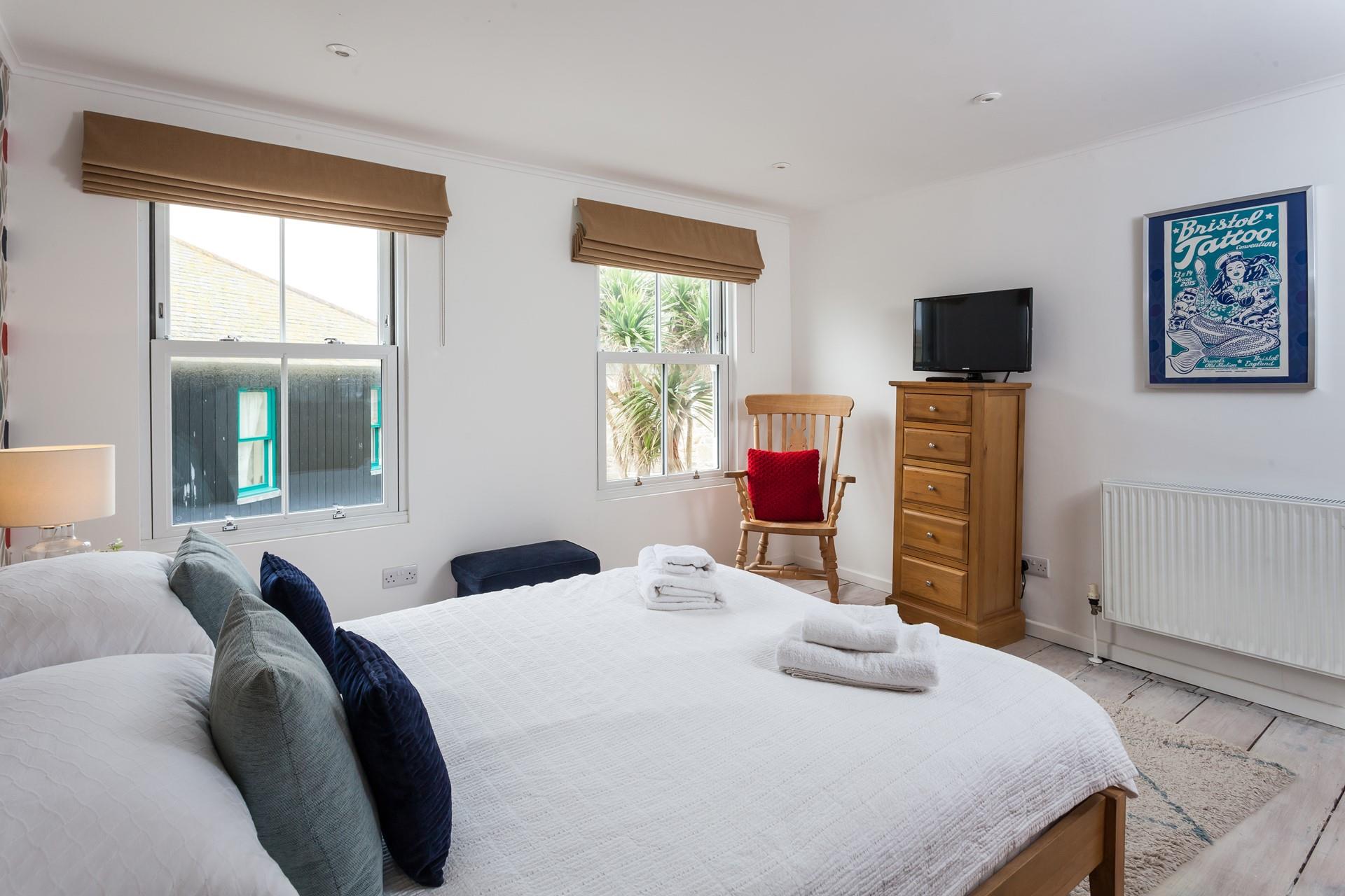 Enjoy a dreamy night's sleep in the king size bed.