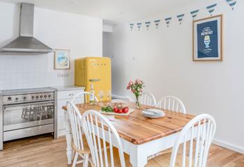 The light and airy kitchen is fully equipped for cooking up a storm.