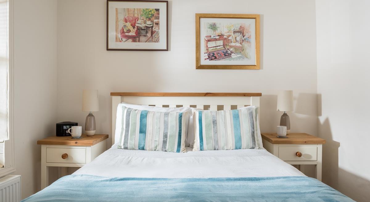 Bedroom 2 has cosy blue interiors and offers a dreamy night's sleep.