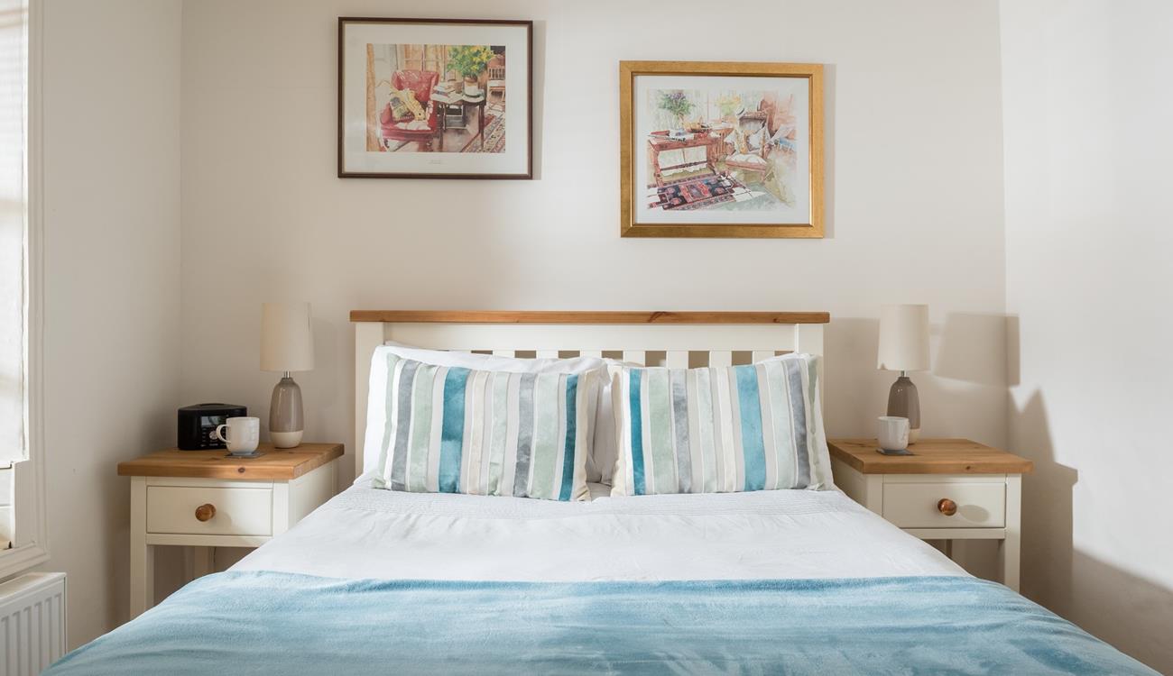 Bedroom 2 has cosy blue interiors and offers a dreamy night's sleep.