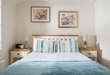 Bedroom 2 has cosy blue interiors and offers a dreamy night's sleep.