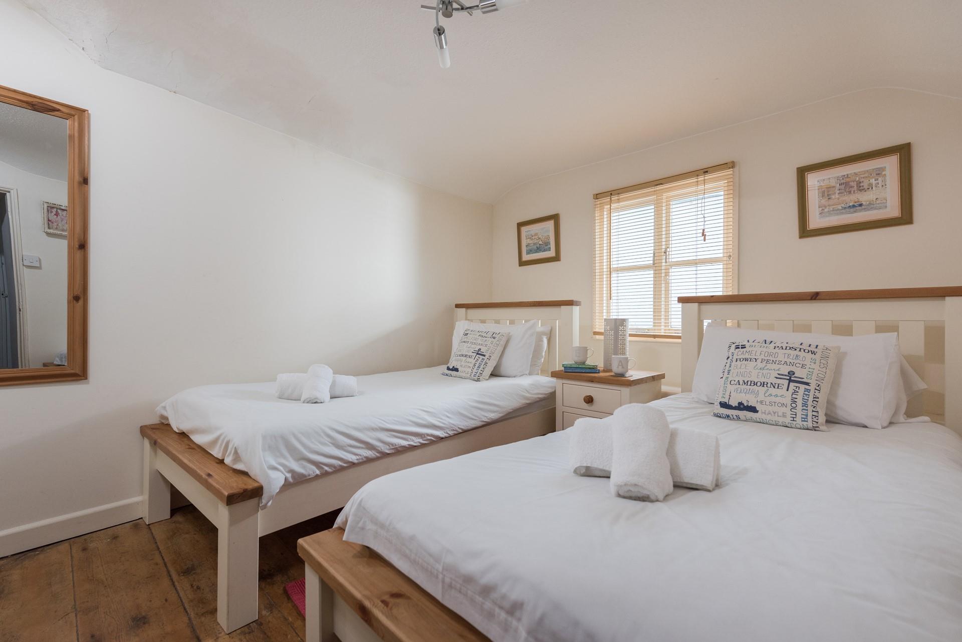 Enjoy a lazy morning in the twin beds. 