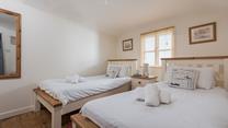 Enjoy a lazy morning in the twin beds. 