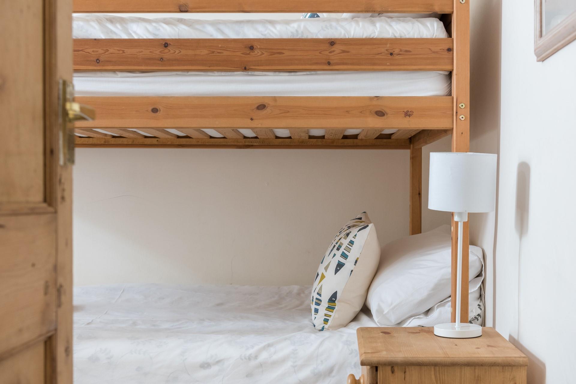 Settle the kids to sleep, they'll be exhausted after a day on the beach.