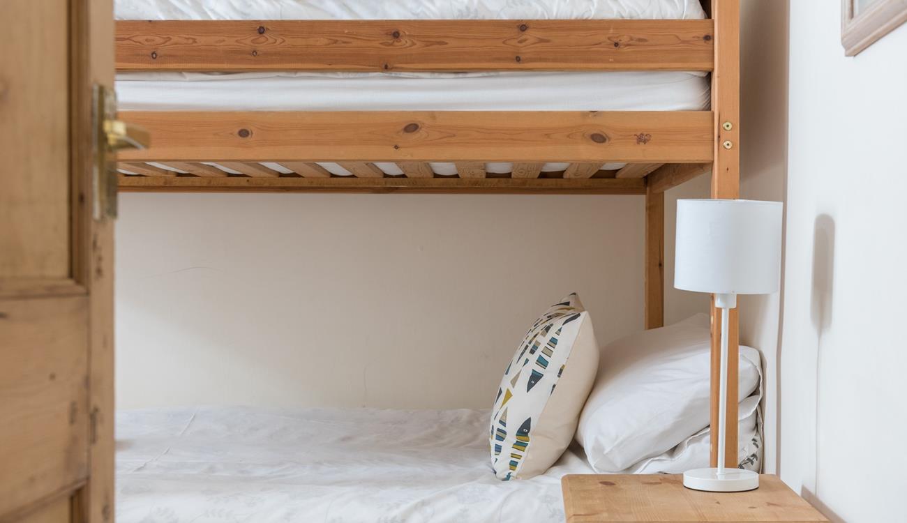 Settle the kids to sleep, they'll be exhausted after a day on the beach.