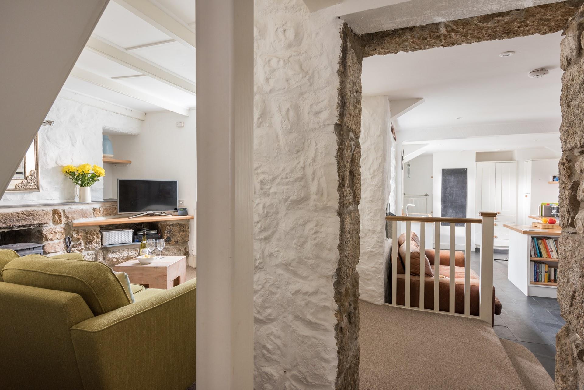 The cottage retains its original features like the granite walls.