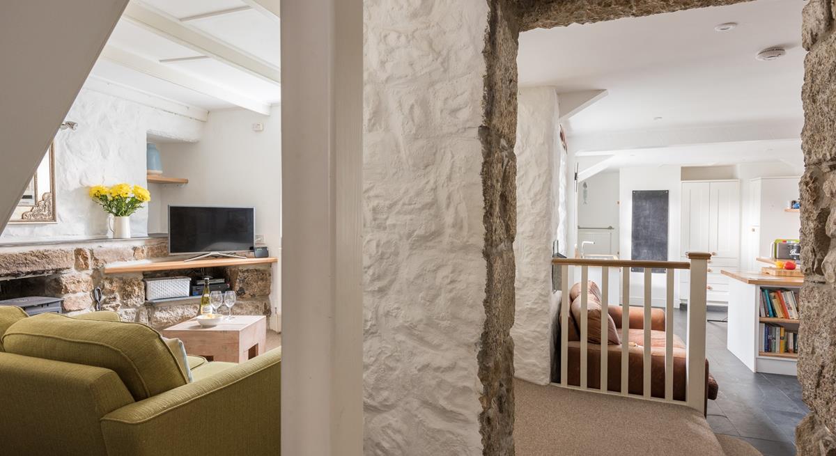 The cottage retains its original features like the granite walls.