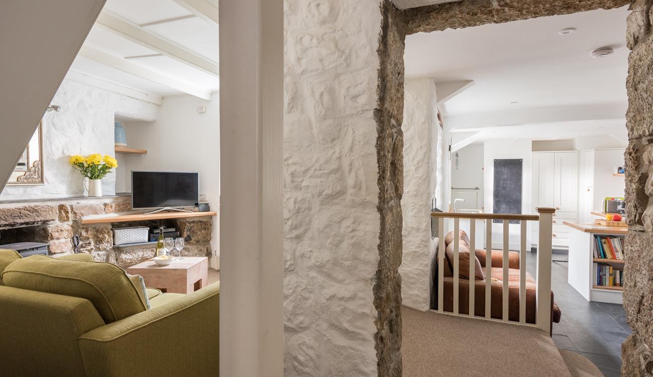 The cottage retains its original features like the granite walls.