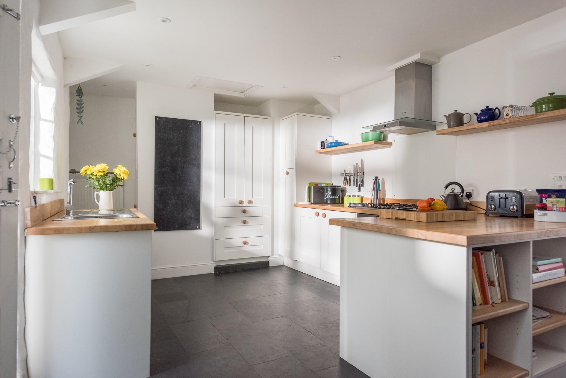 The country style kitchen is a great space for cooking.