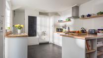 The country style kitchen is a great space for cooking.