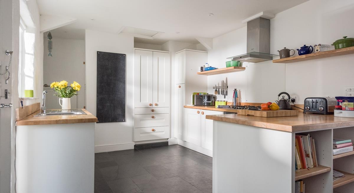 The country style kitchen is a great space for cooking.