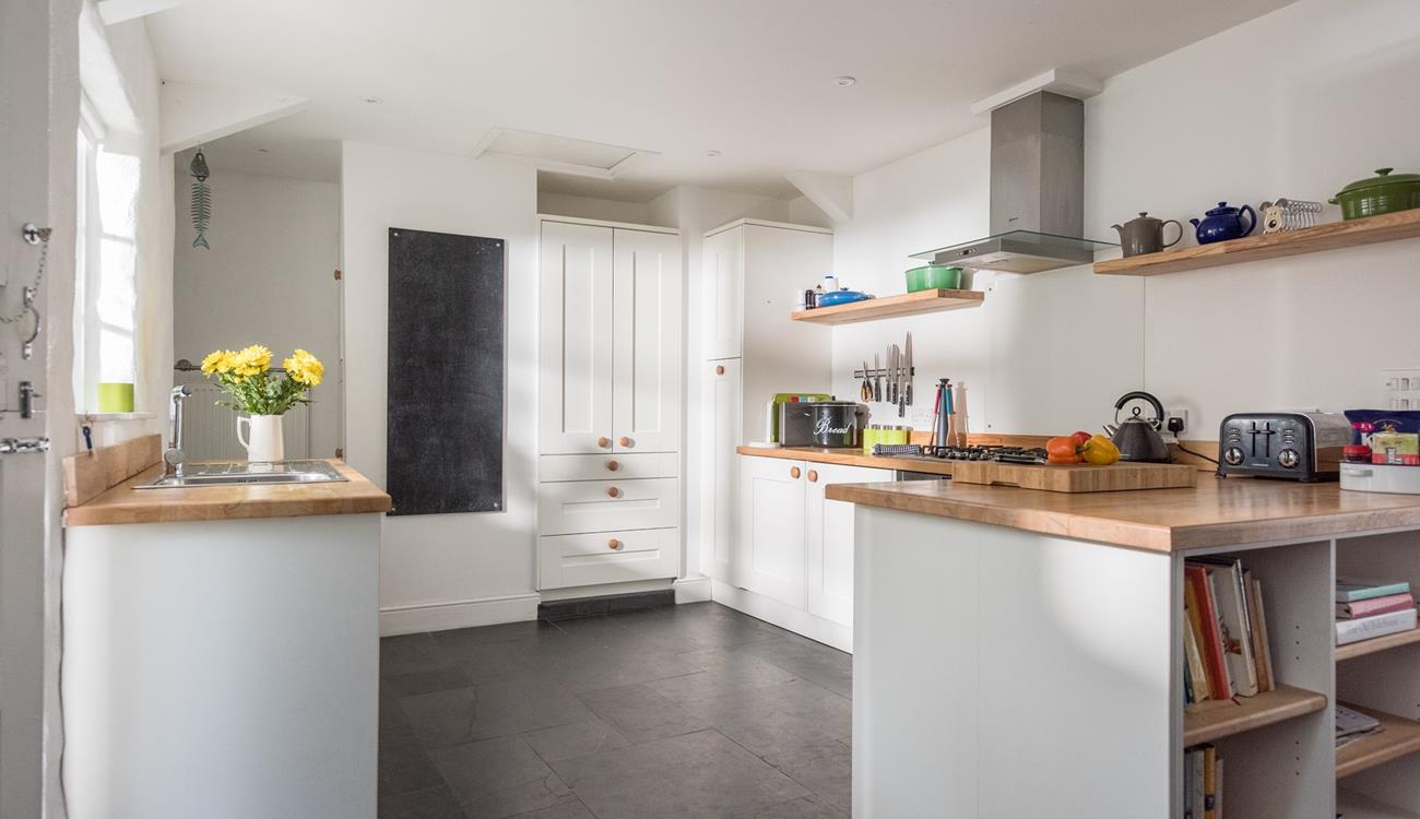 The country style kitchen is a great space for cooking.