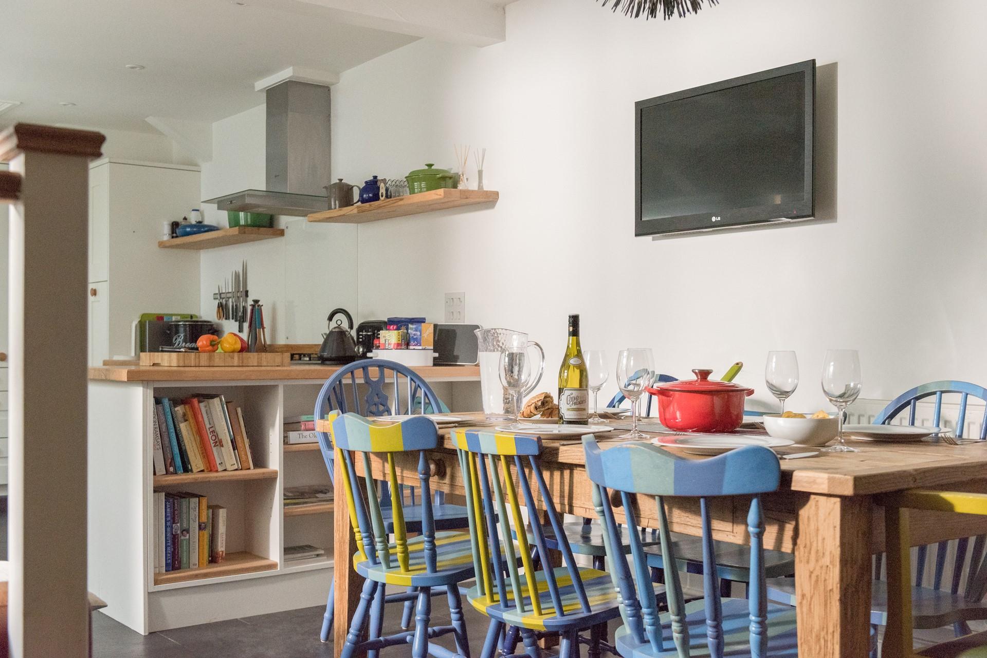 The unique chairs ooze colour through the dining space.