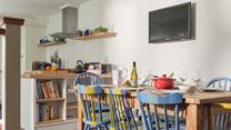 The unique chairs ooze colour through the dining space.