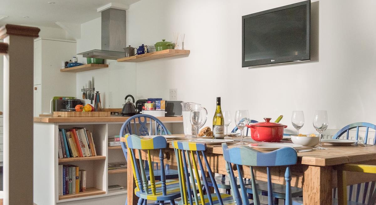 The unique chairs ooze colour through the dining space.