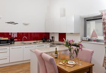The kitchen is well-equipped with delightful seaside-themed touches!