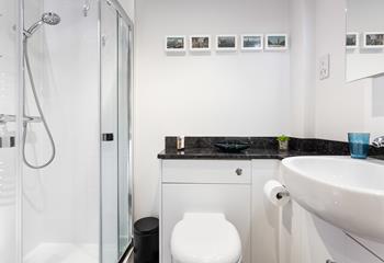 Start your day with an invigorating shower in the sleek bathroom.