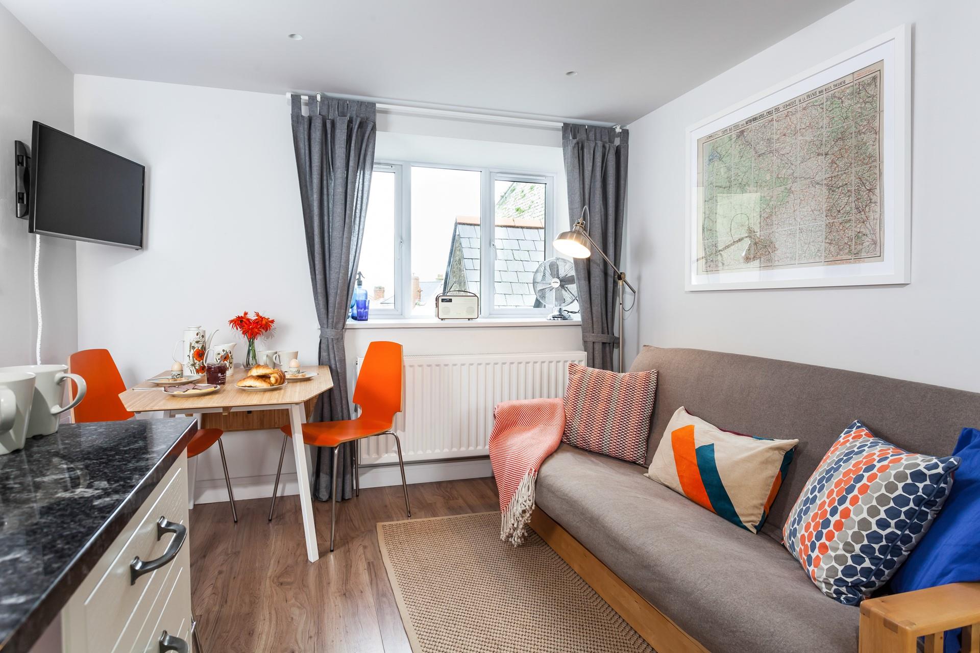 The living area is intimate yet the open plan design prevents it from feeling cluttered.