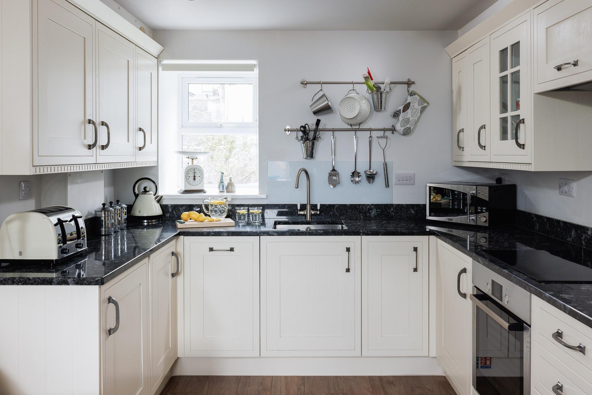 Beautifully designed with a sleek, modern finish, the kitchen is perfect for whipping up delicious meals.