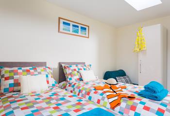 The room has colourful yet minimalistic decor, the perfect space to relax after a day of exploring Newquay!