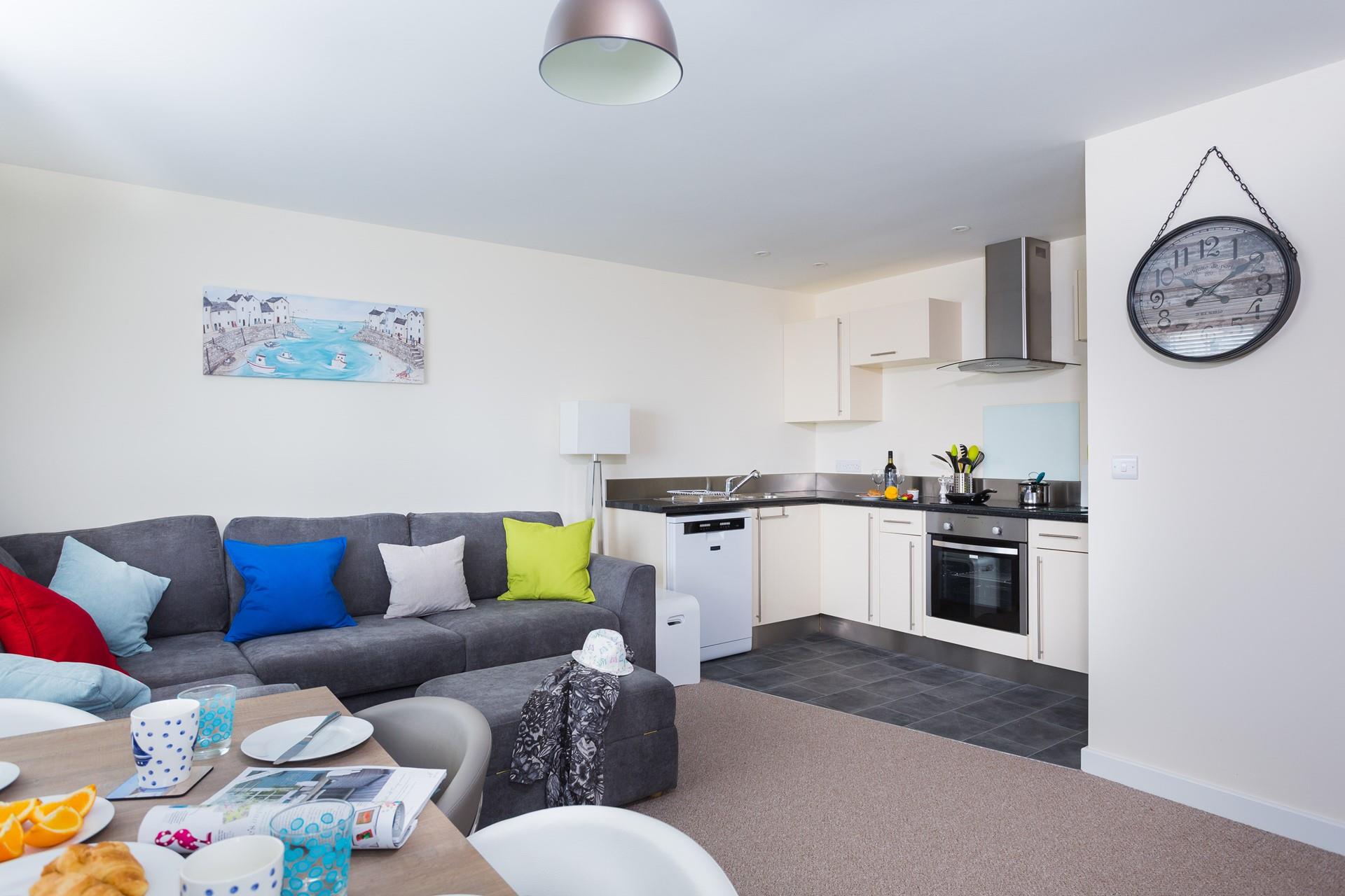 The colourful decor gives this apartment a fun, seaside-inspired feel!