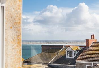 Gaze out over the quaint St Ives roof tops to the sea beckoning you down to the beach!