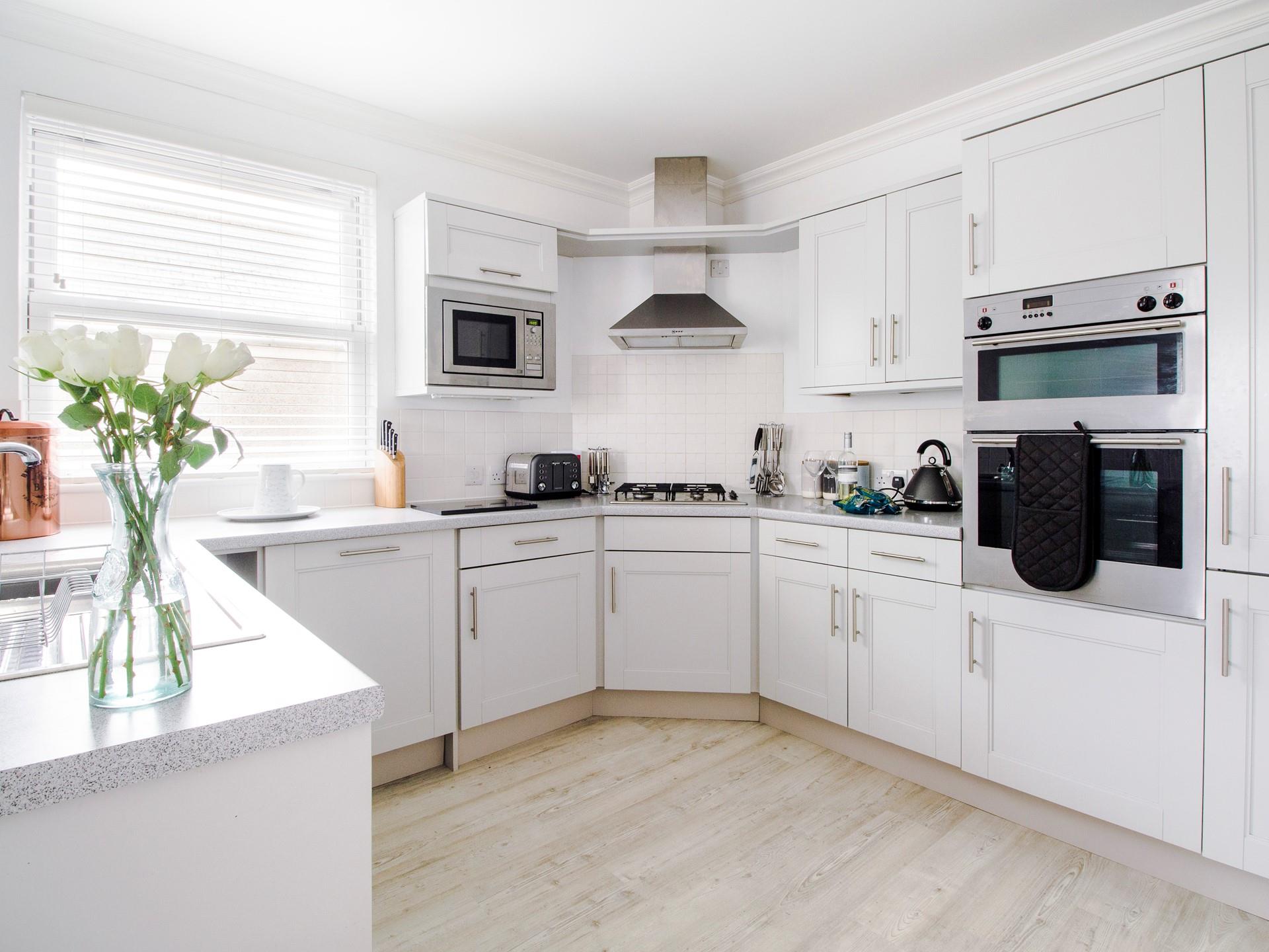 The stunning kitchen is packed with modern appliances to make cooking up a feast an absolute breeze!