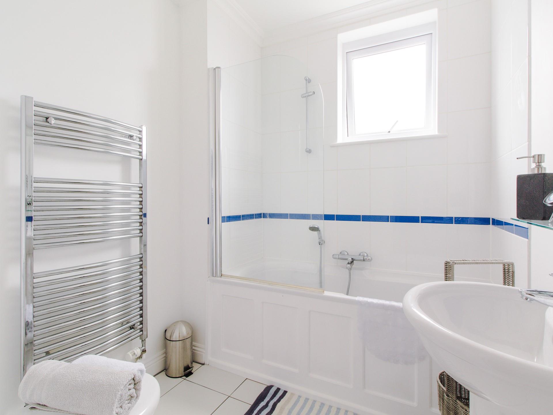 The main bathroom benefits from a bath with shower, perfect for washing the sand away after a day on one of St Ives golden beaches! 