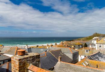 Beautiful views of Porthmeor Beach over the rooftops of St Ives.