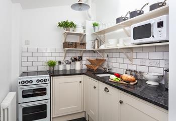 The kitchen is fully equipped for all your cooking needs.