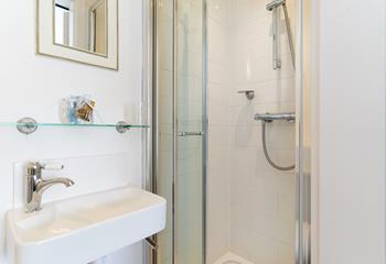 The ensuite is perfect for washing off sandy toes after a day on the beach.