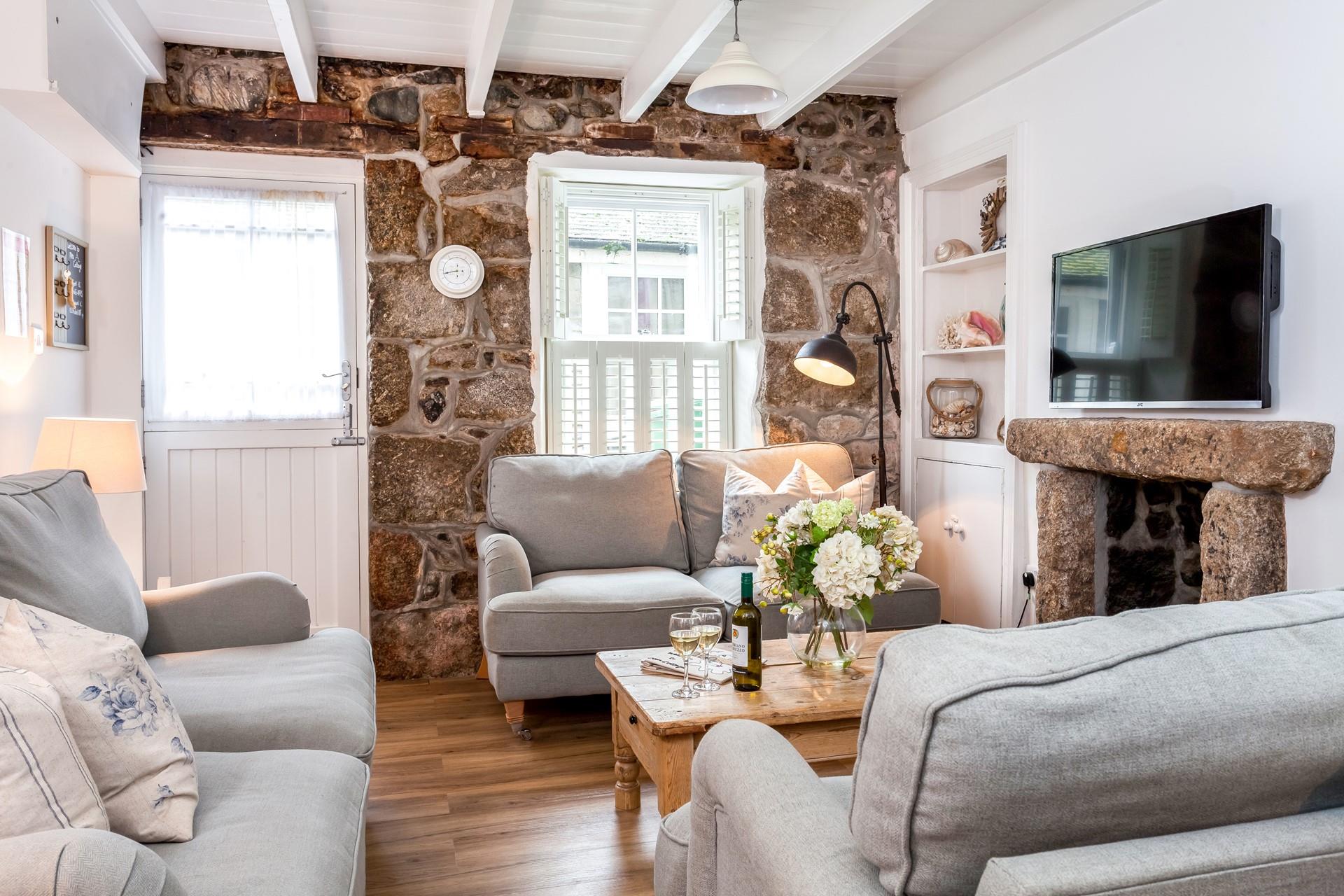 The sitting room is cosy and stylish, perfect for spending evenings in.