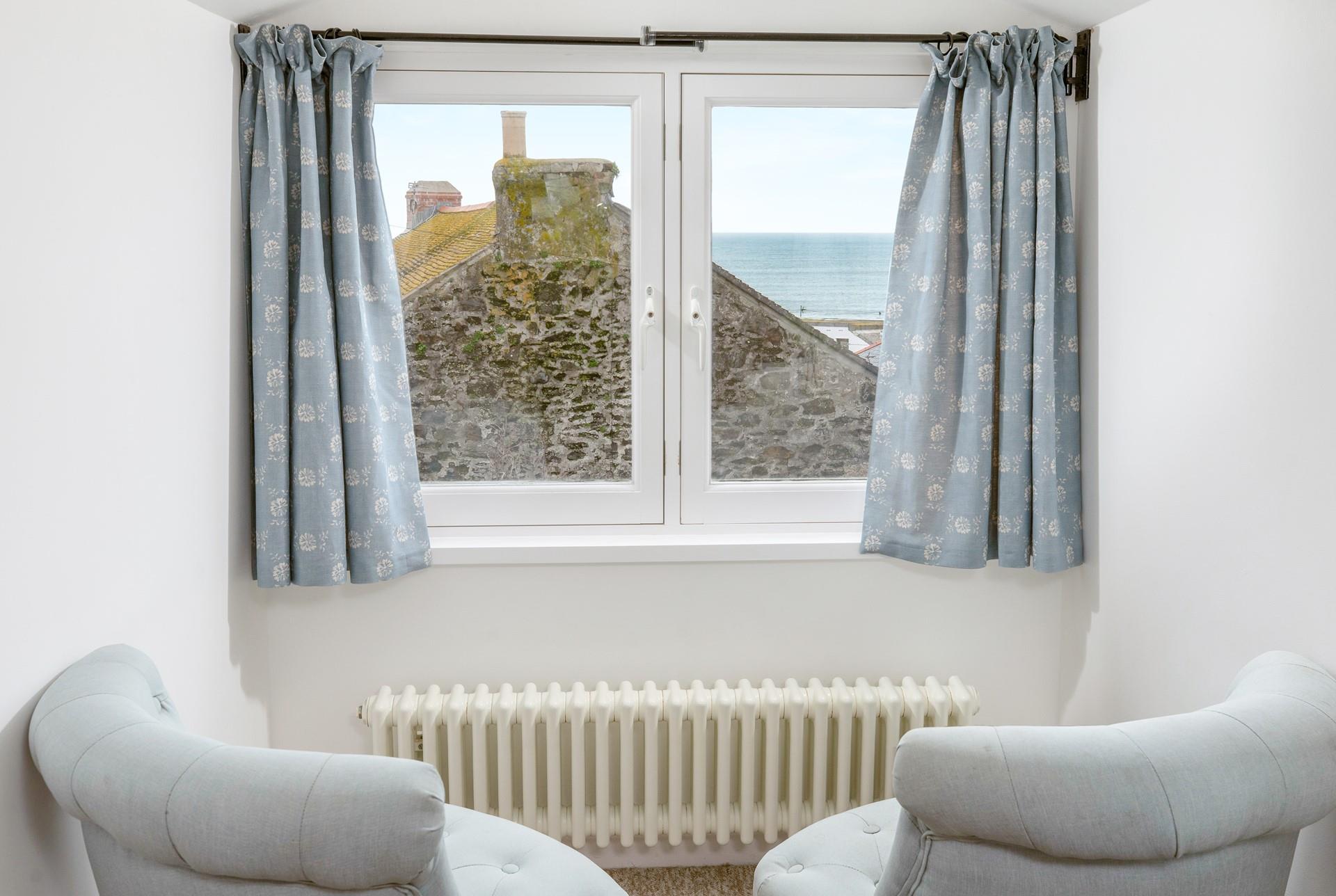 The window is the perfect spot to sit and enjoy a cuppa.