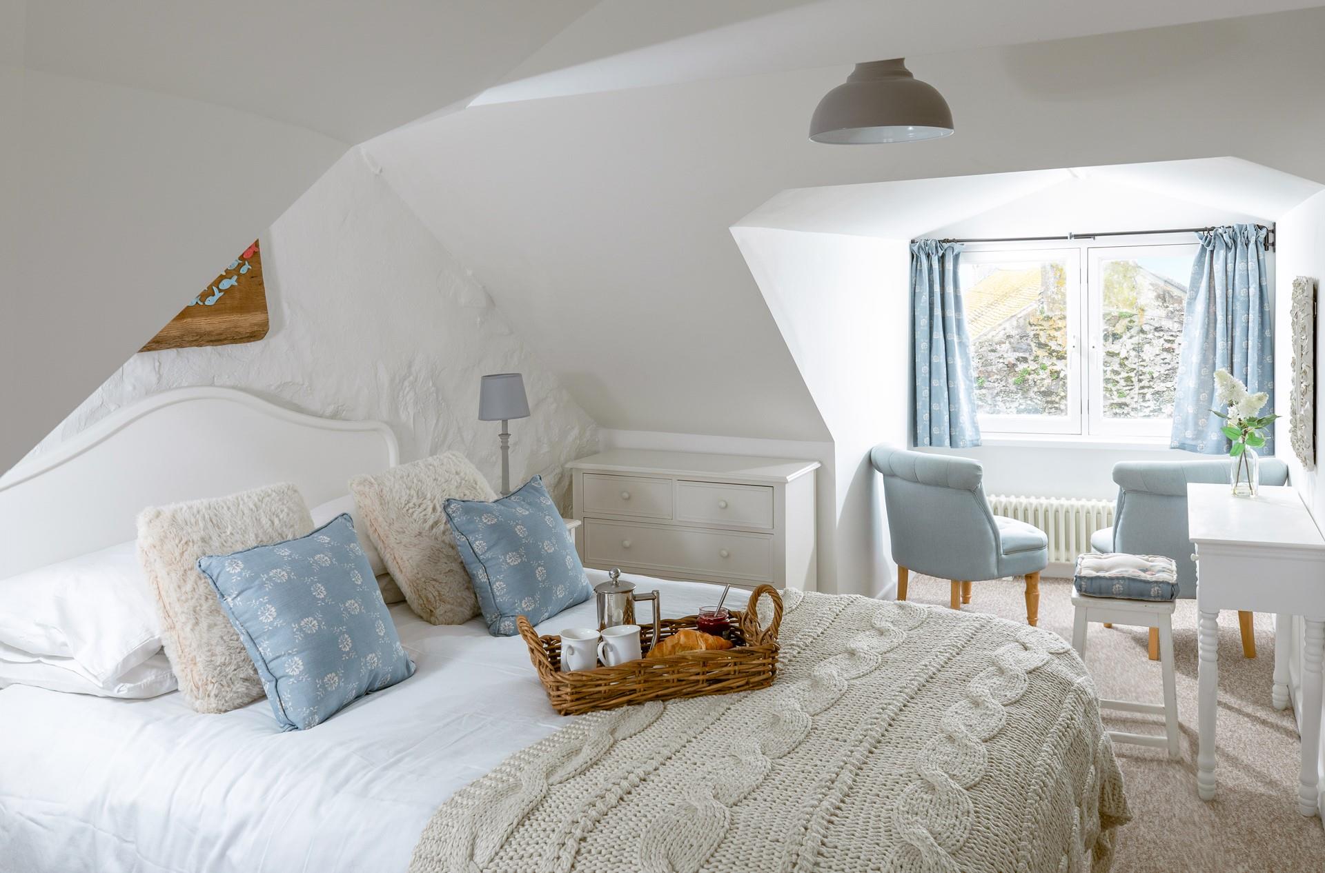 The spacious king size bed offers a relaxing night's sleep.