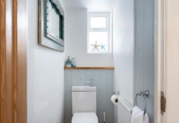 There is a separate cloakroom which has a WC with an integrated hand basin.
