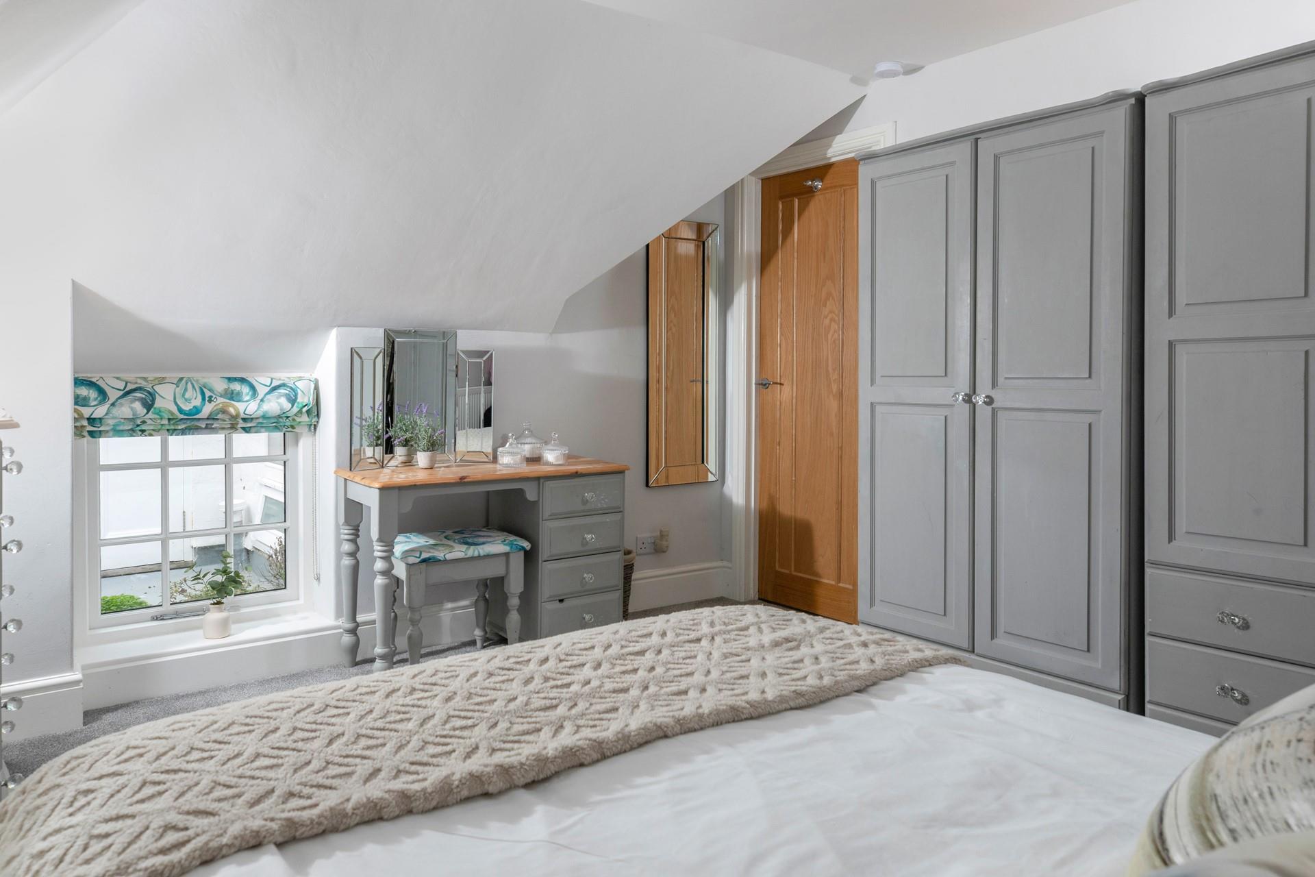 The spacious double bedroom has plenty of storage for your holiday wardrobe!