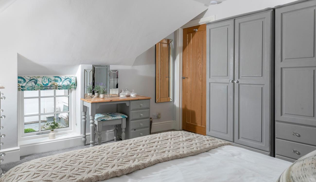 The spacious double bedroom has plenty of storage for your holiday wardrobe!