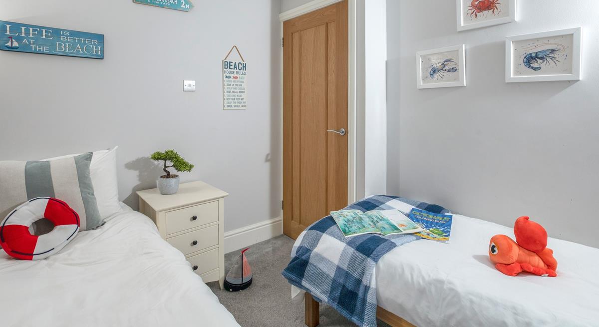 The seaside-themed bedroom is perfect for the little ones.