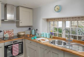 The kitchen is light and bright, with all the amenities you need.