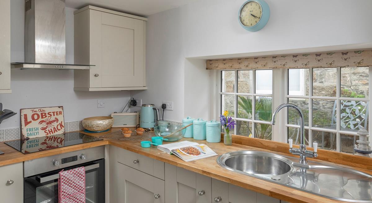 The kitchen is light and bright, with all the amenities you need.