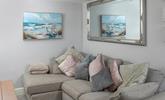 Snuggle up on the comfy corner sofa.  - Thumbnail Image