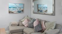 Snuggle up on the comfy corner sofa. 