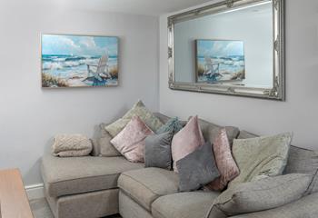 Snuggle up on the comfy corner sofa. 